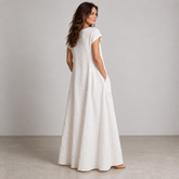 Rear three-quarter view of Cuirsy white loose-fit linen maxi dress