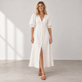 Front view of Cuirsy cream button-front linen dress with puff sleeves