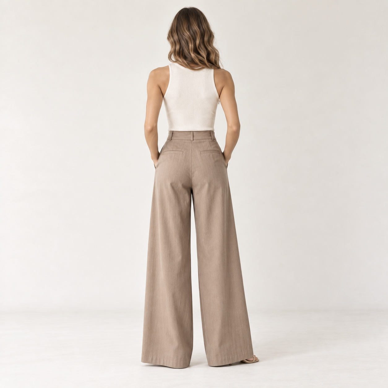 Cuirsy warm taupe high-waisted pleated cotton palazzo trousers back view