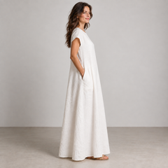 Side view of Cuirsy white loose-fit linen maxi dress with pocket